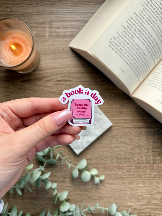 A Book A Day Keeps The Reality Away Sticker
